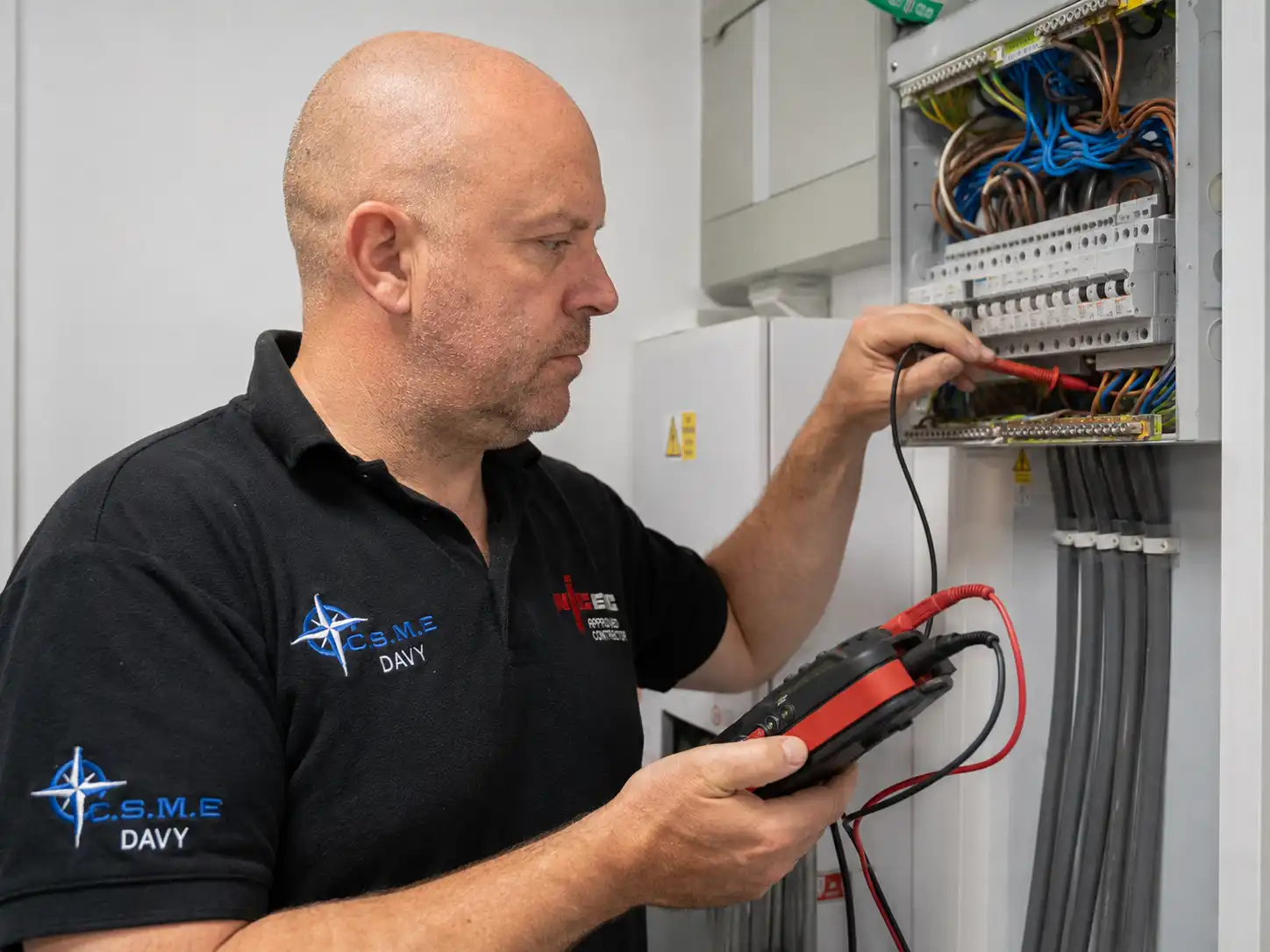 Davy carrying out electrical inspection and testing at a distribution board